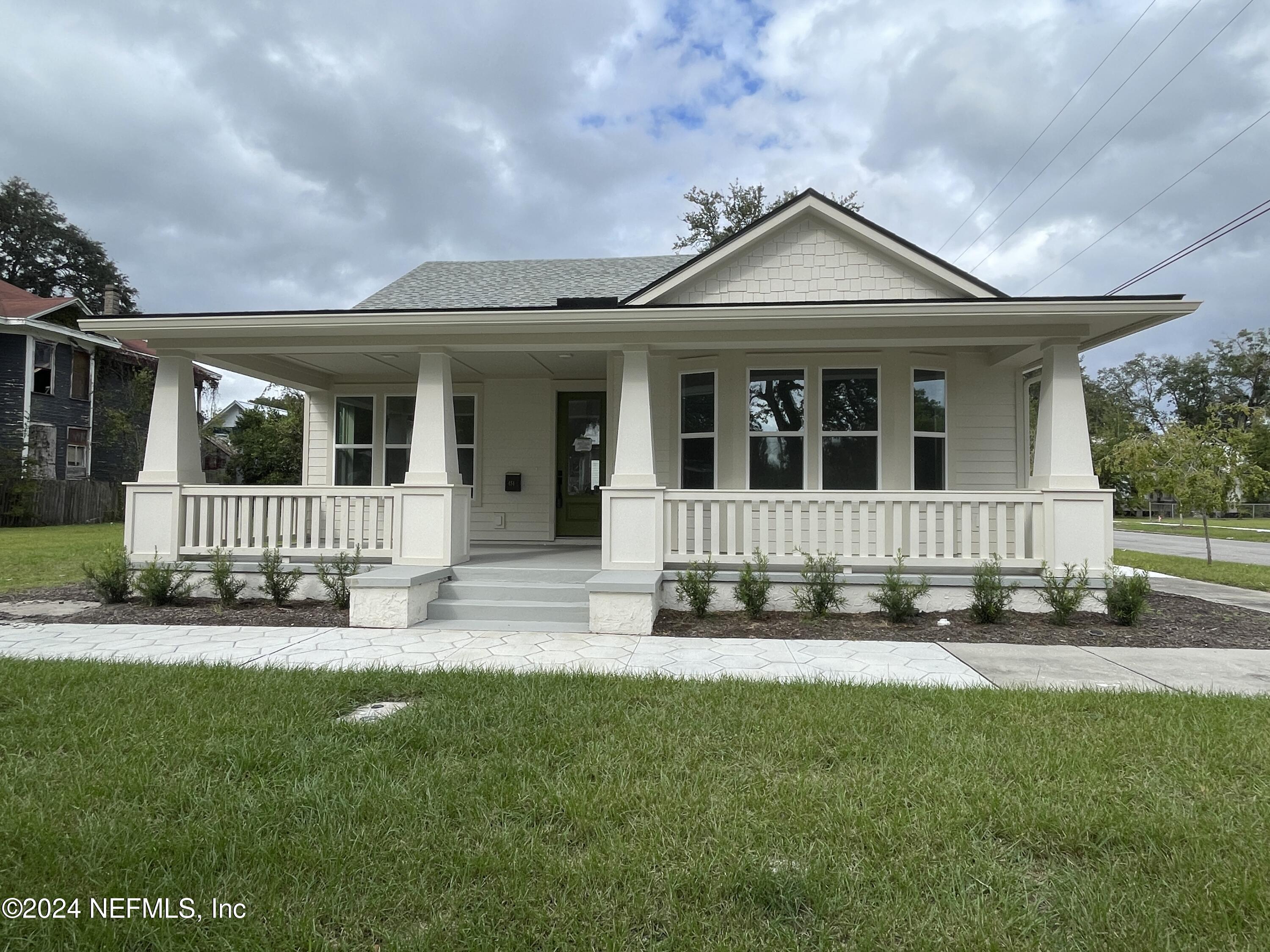 front view of a house with a yard