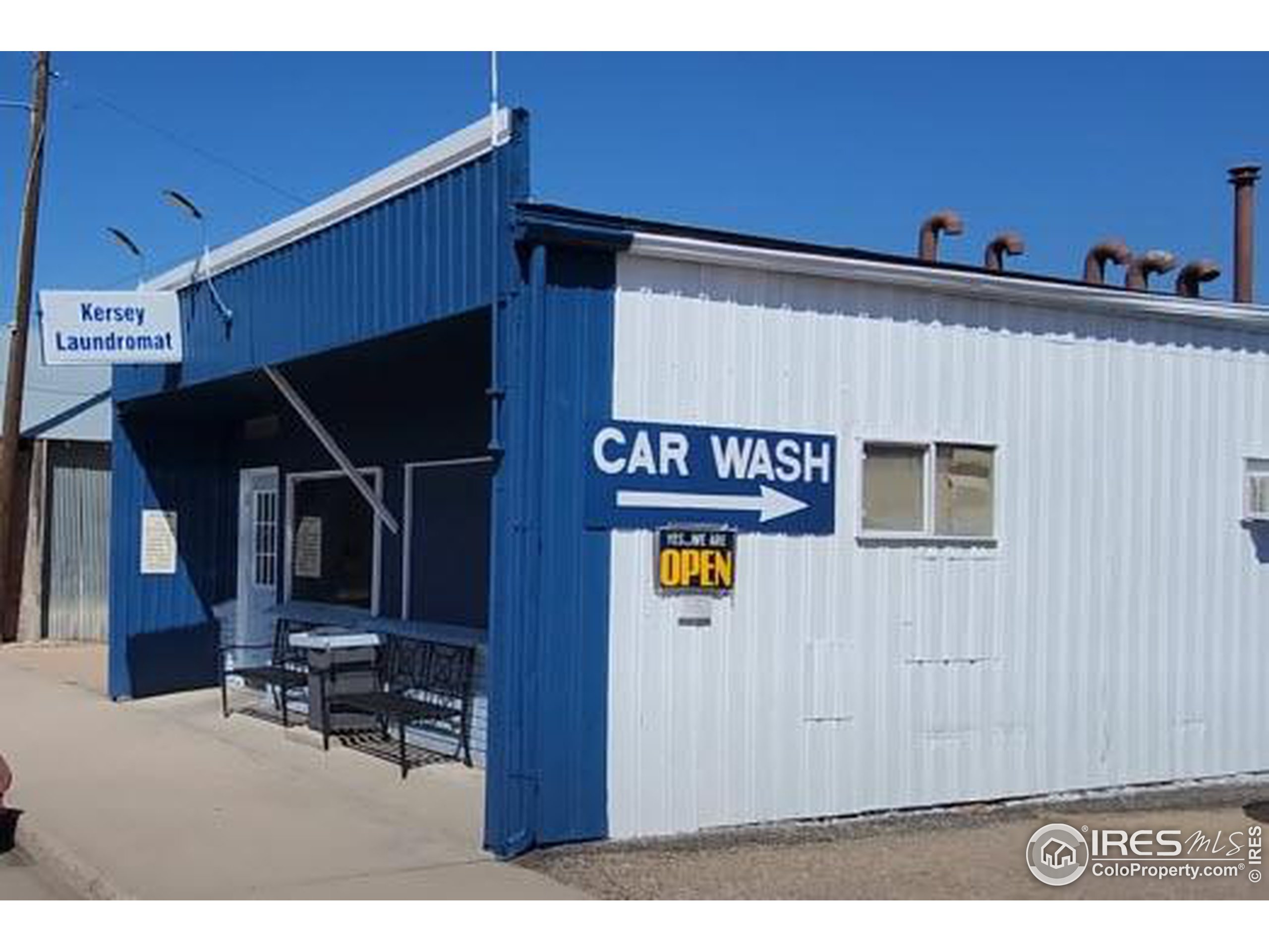 a garage with stainless steel appliances a refrigerator and a stove