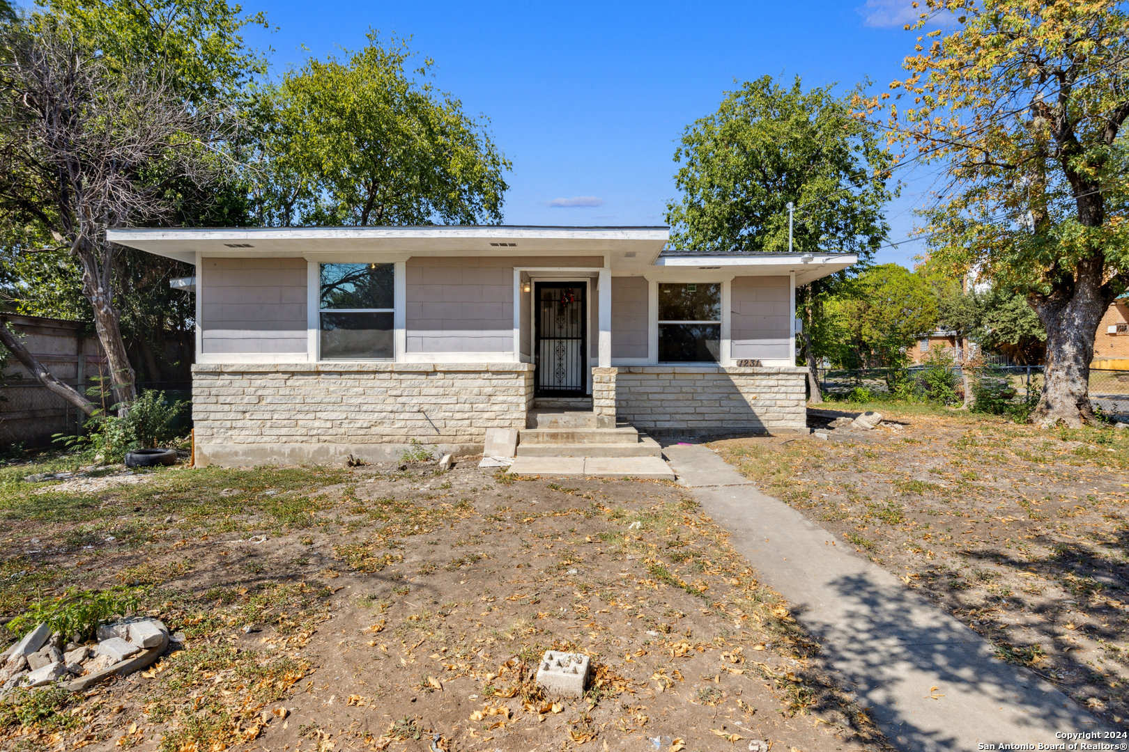 front view of a house with a yard