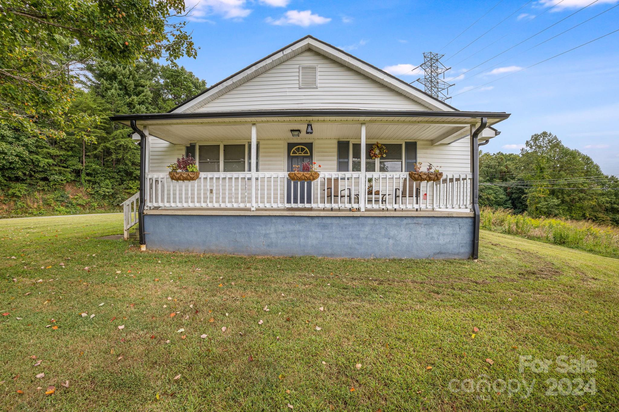 a view of house with backyard and garden