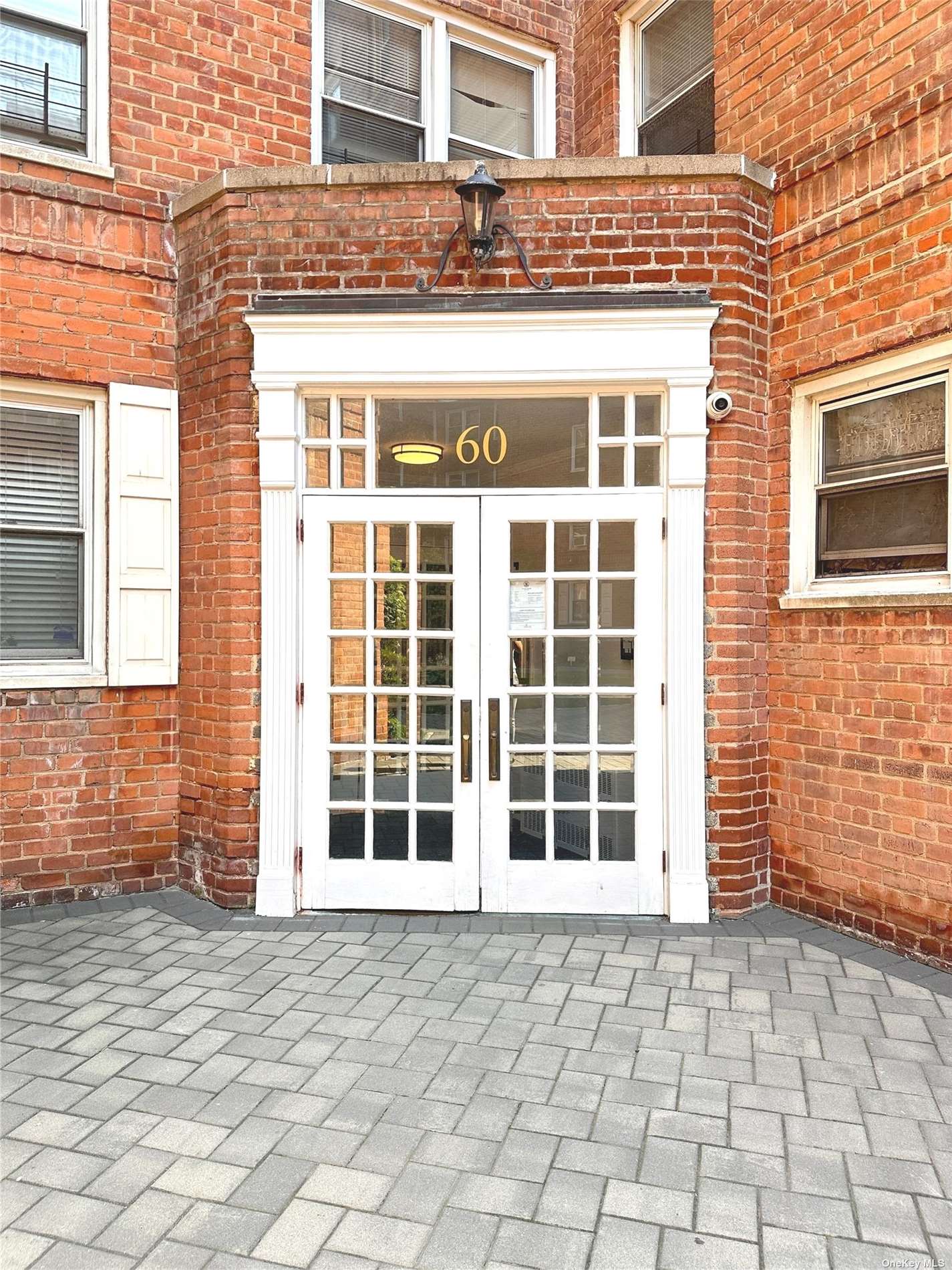 a front view of a building with a glass windows