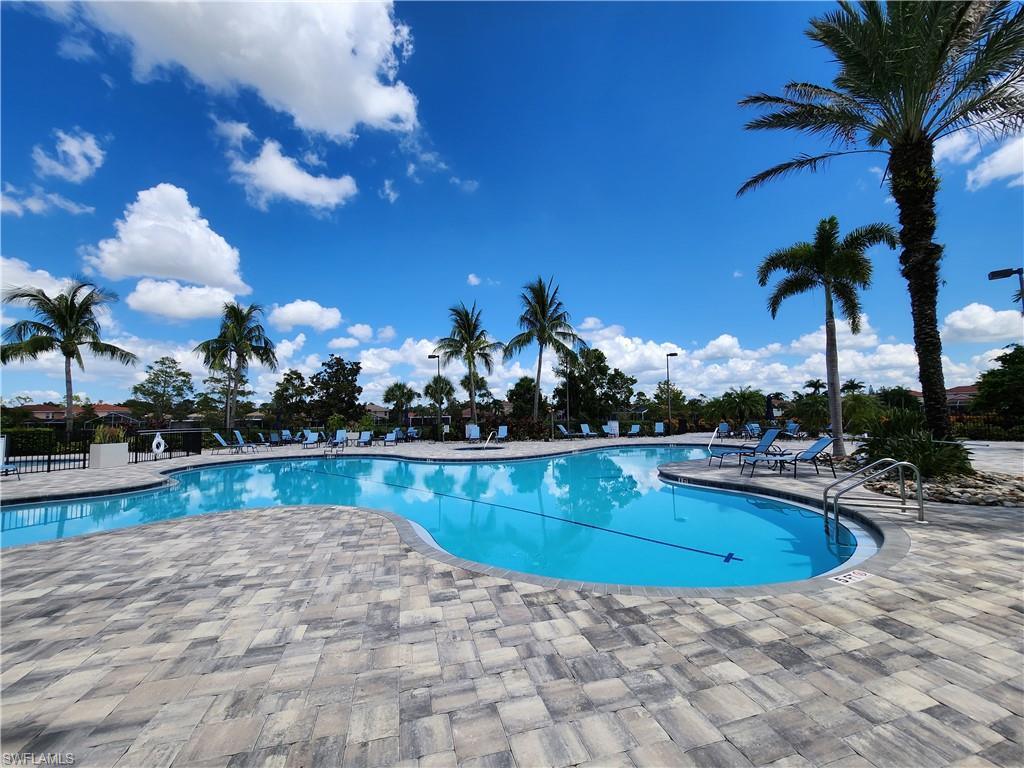 a view of a swimming pool and lounge chair