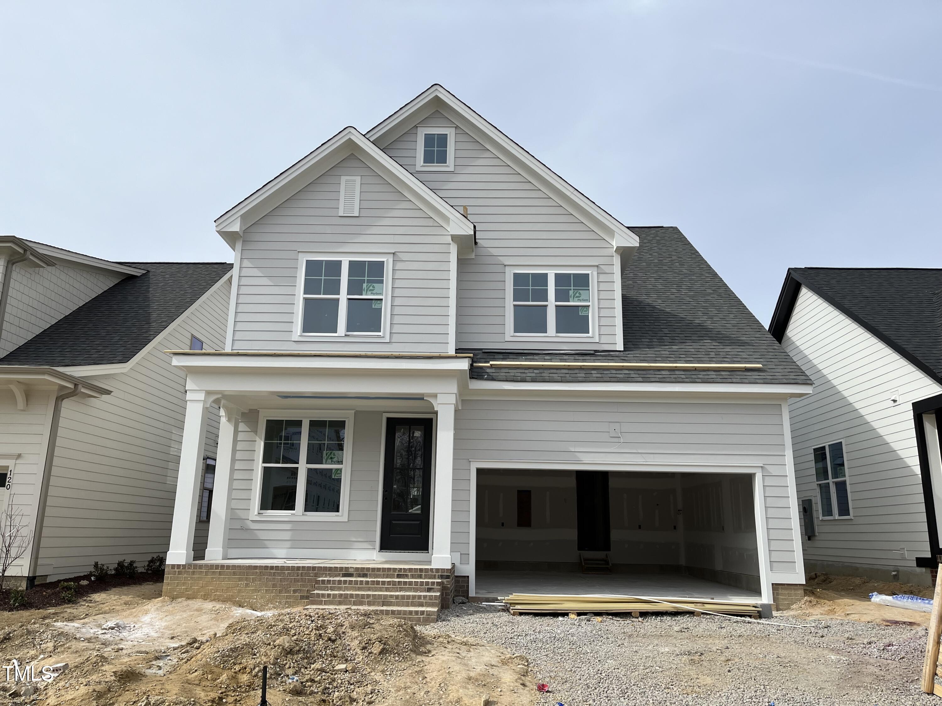 a front view of a house with a garage