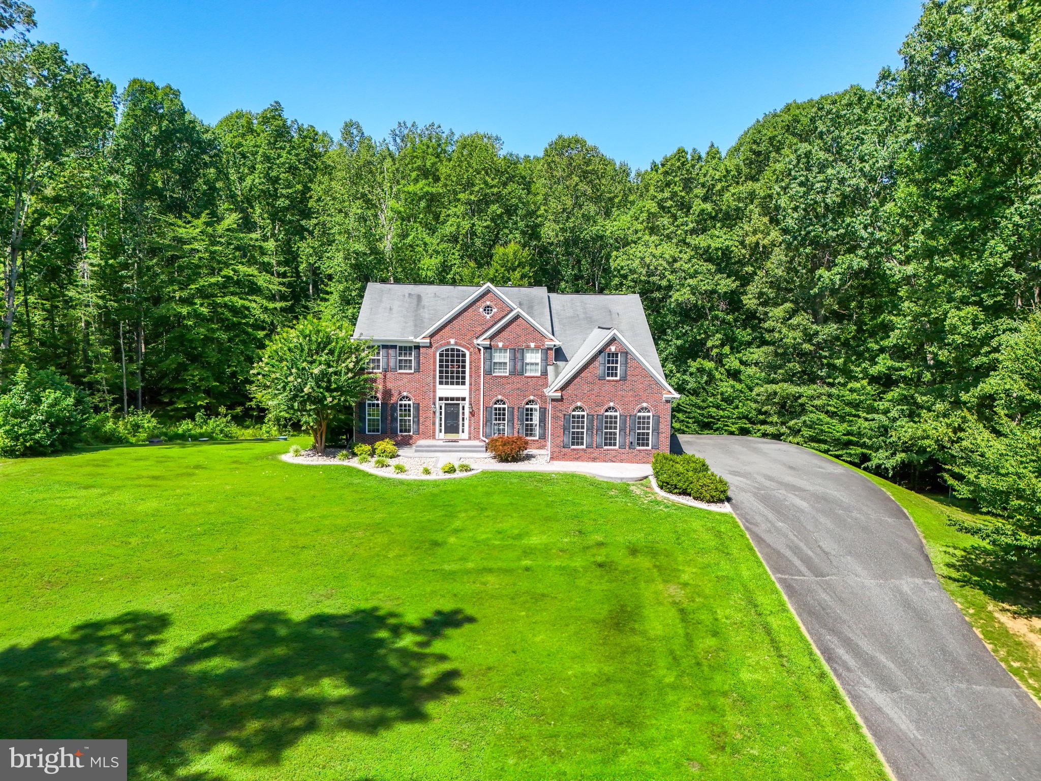 a aerial view of a house with a big yard