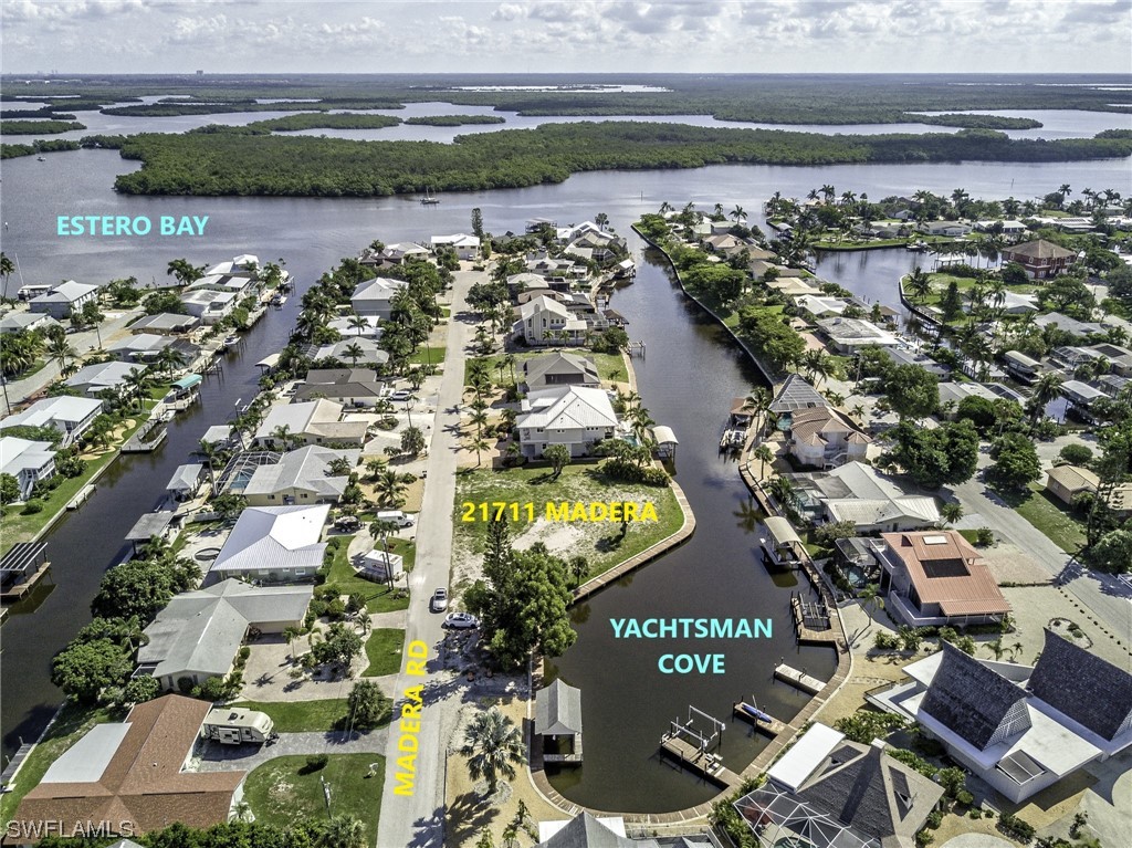 an aerial view of a residential building and lake view