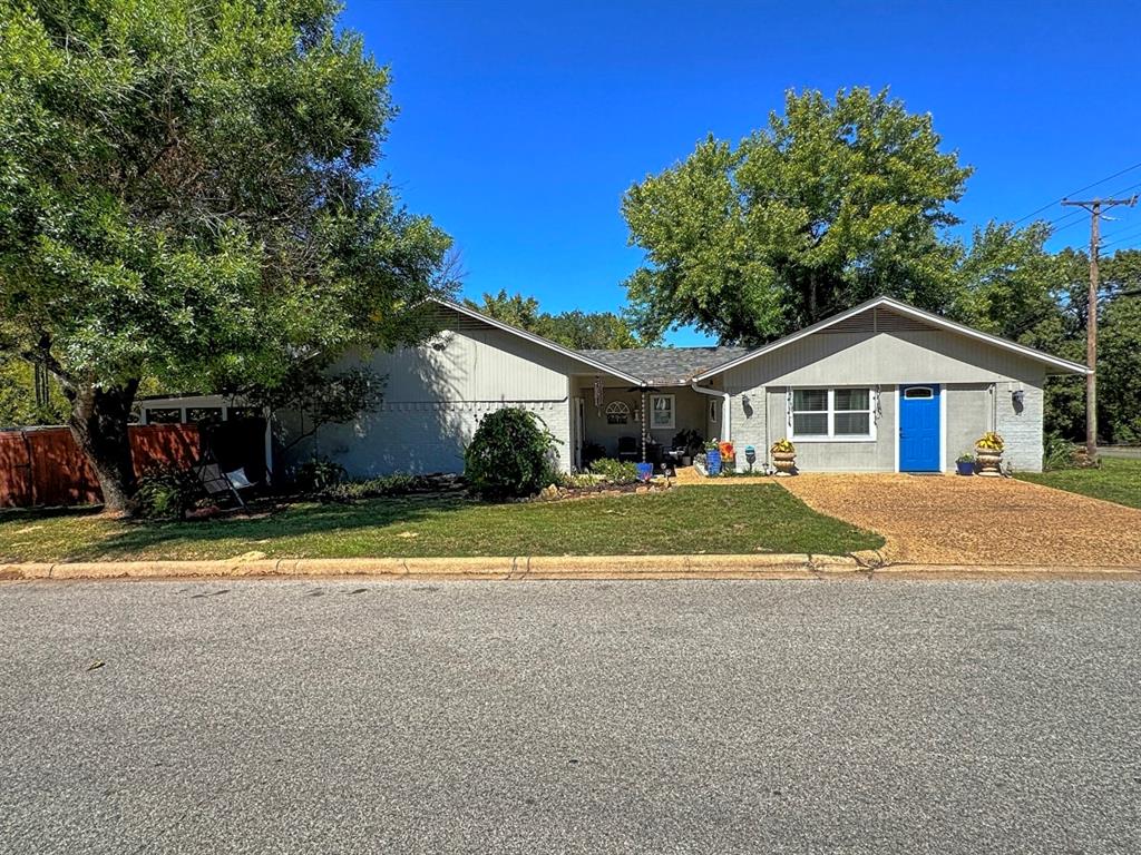 a house with trees in the background