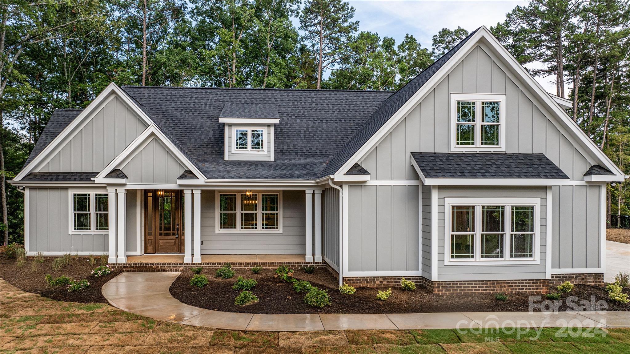 a front view of a house with a yard