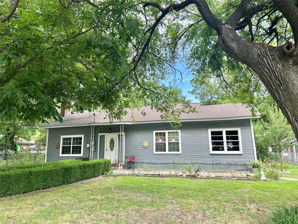 front view of a house with a yard