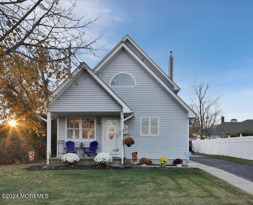 a front view of house with yard and seating area