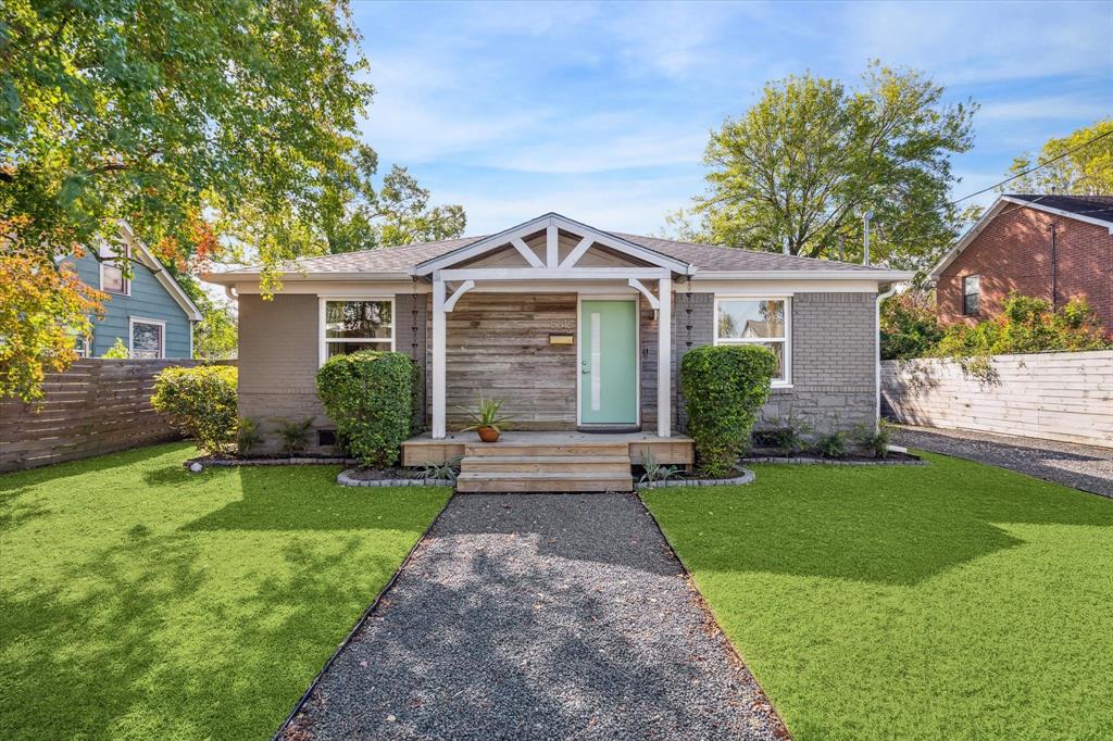 Charming and modern, this renovated 3 bedroom/3 full bath home boasts a welcoming front porch with rustic wood accents, a stylish mint-green door, and meticulously maintained landscaping. Nestled in a quiet neighborhood just moments from Downtown, it offers both curb appeal and contemporary design.