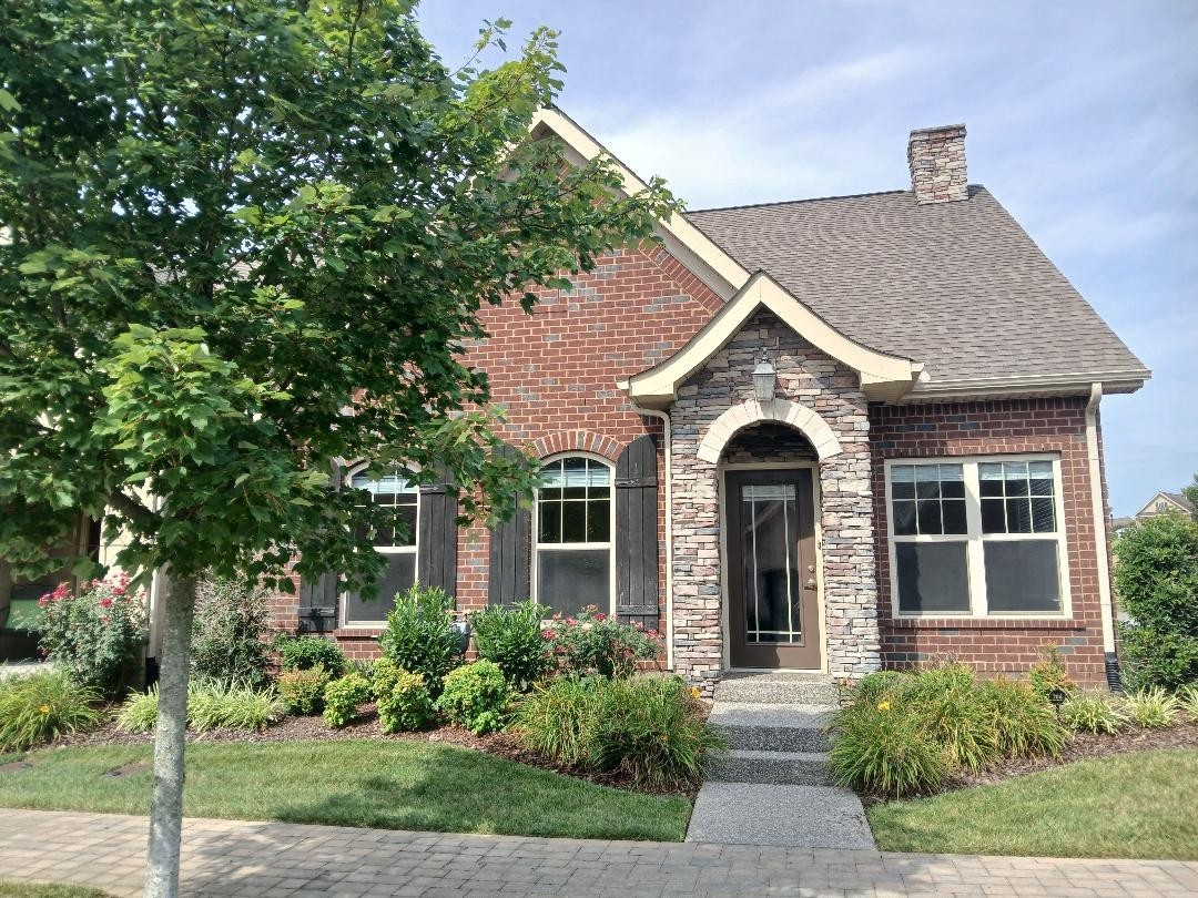 Welcome to this lovely brick home! Upon entering to right is a light filled room perfect for office, library/media or craft area. An elegant arched doorway leads into open and spacious living room.