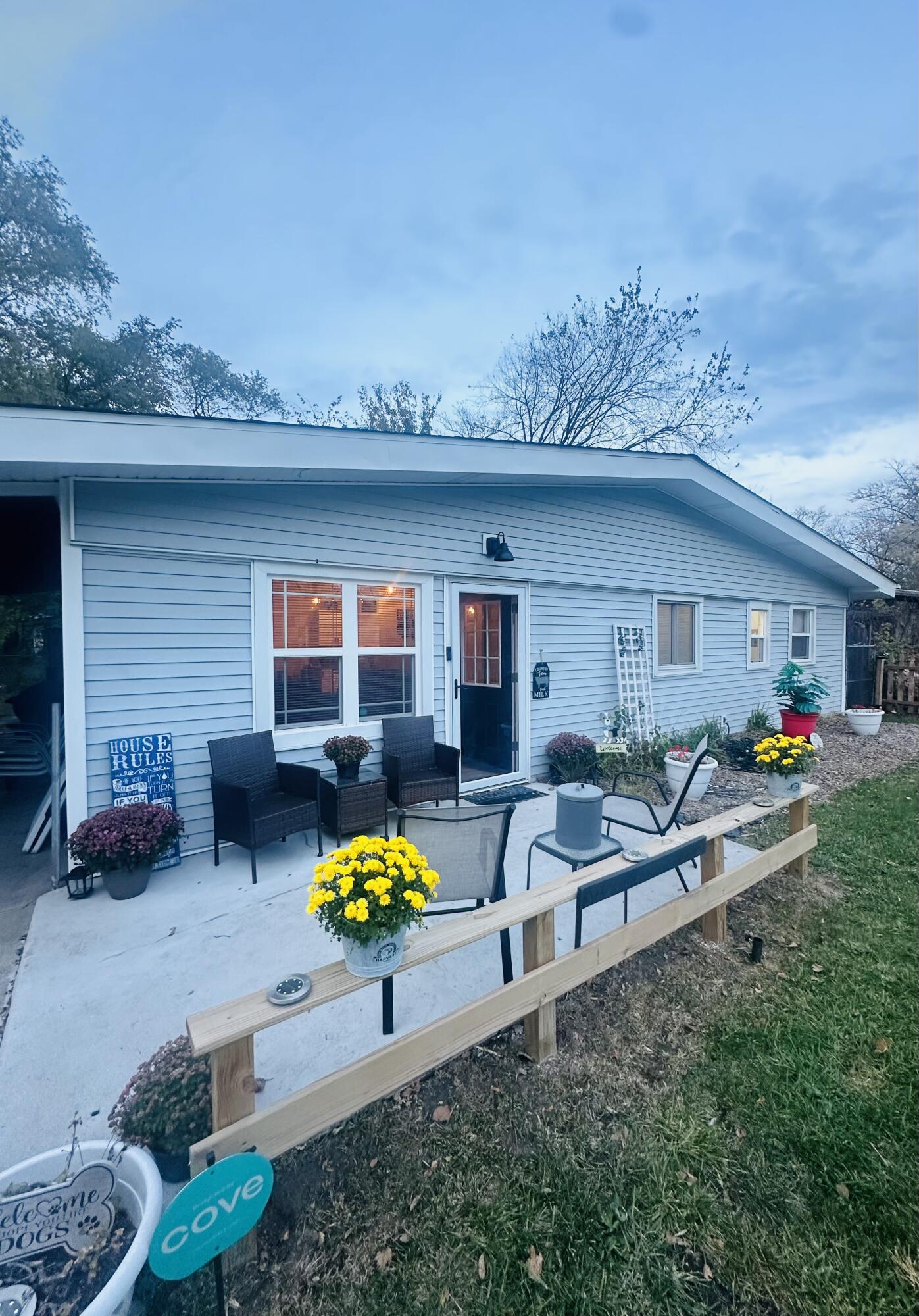 a view of a backyard with a sitting area and furniture