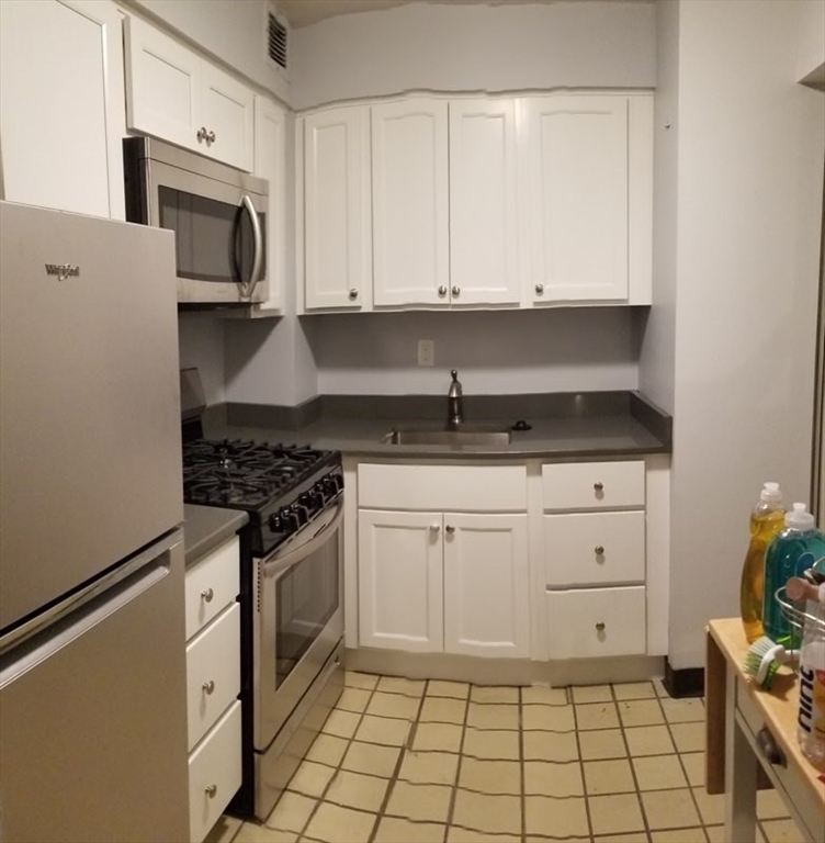 a kitchen with a stove and a microwave