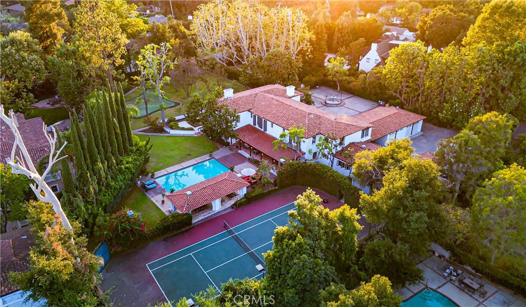 an aerial view of a pool patio yard and outdoor seating