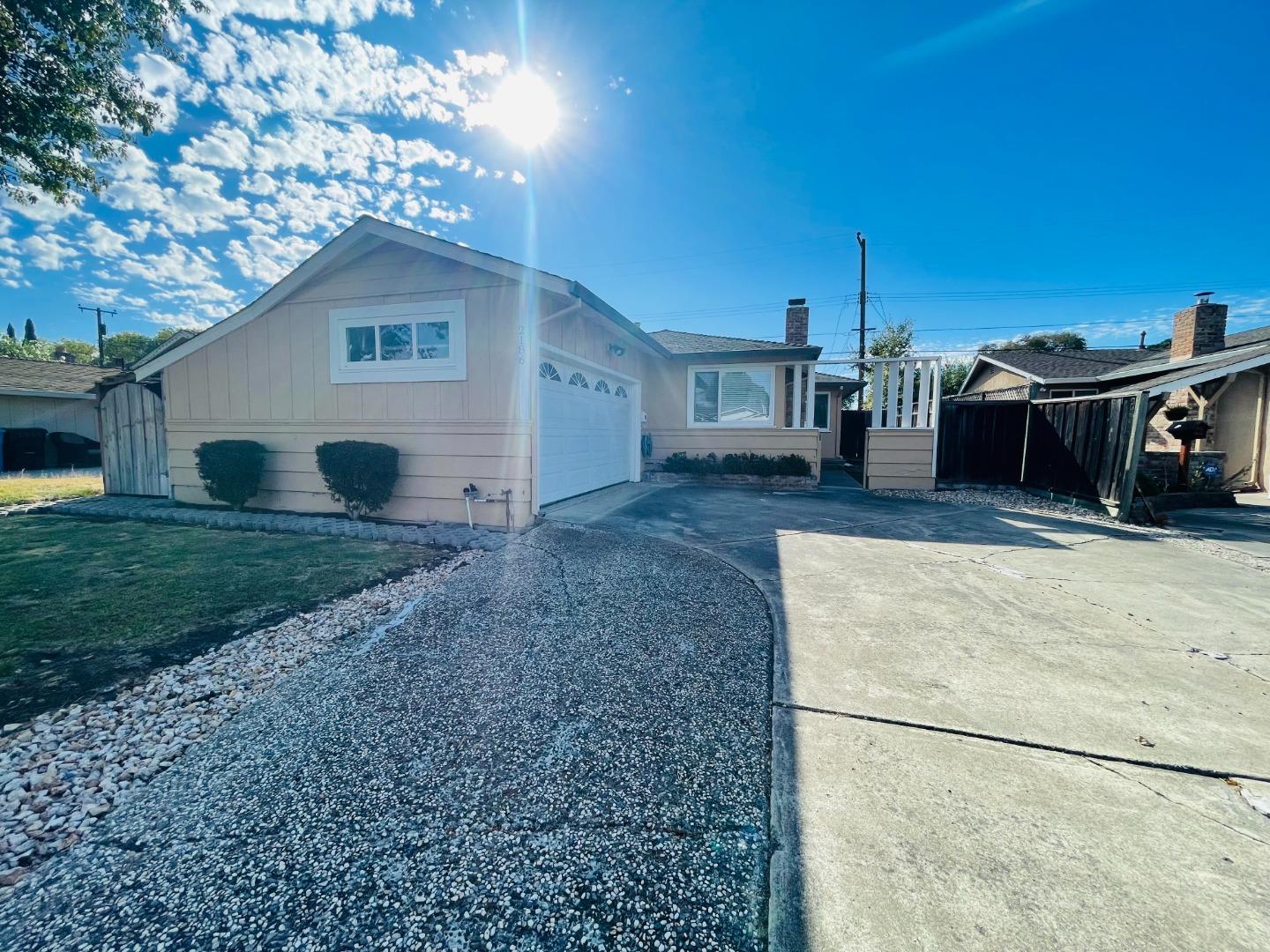 a view of a house with a backyard