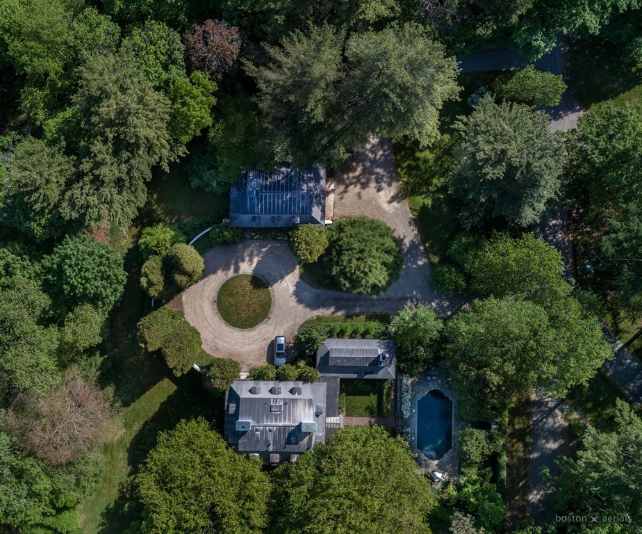 an aerial view of a house with outdoor space