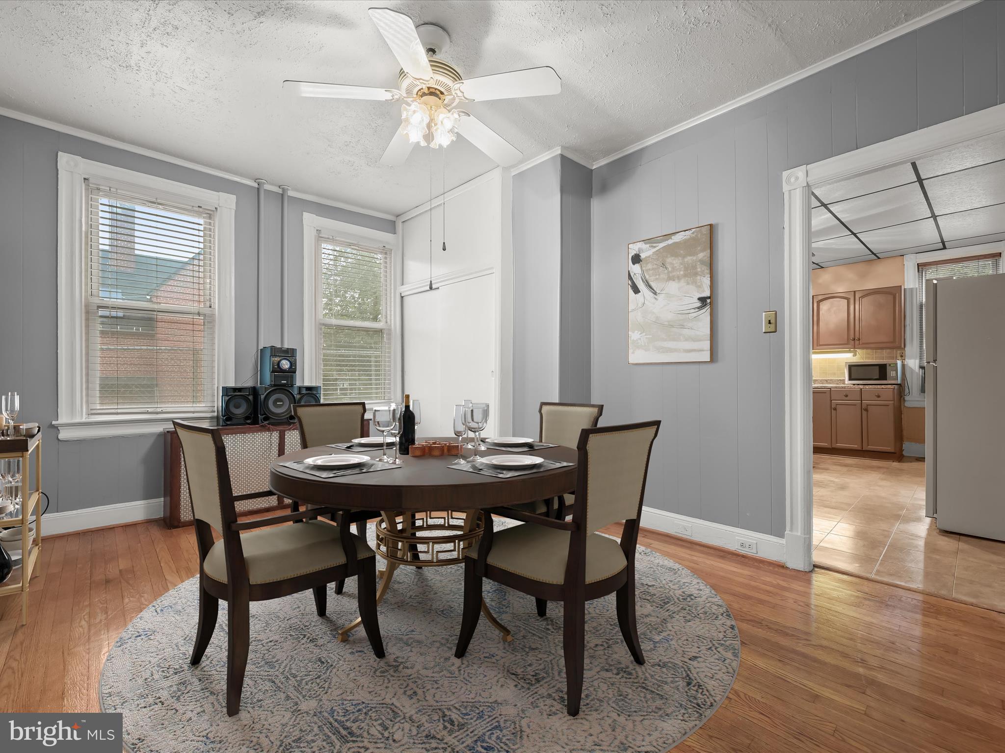 a view of a dining room with furniture window and wooden floor