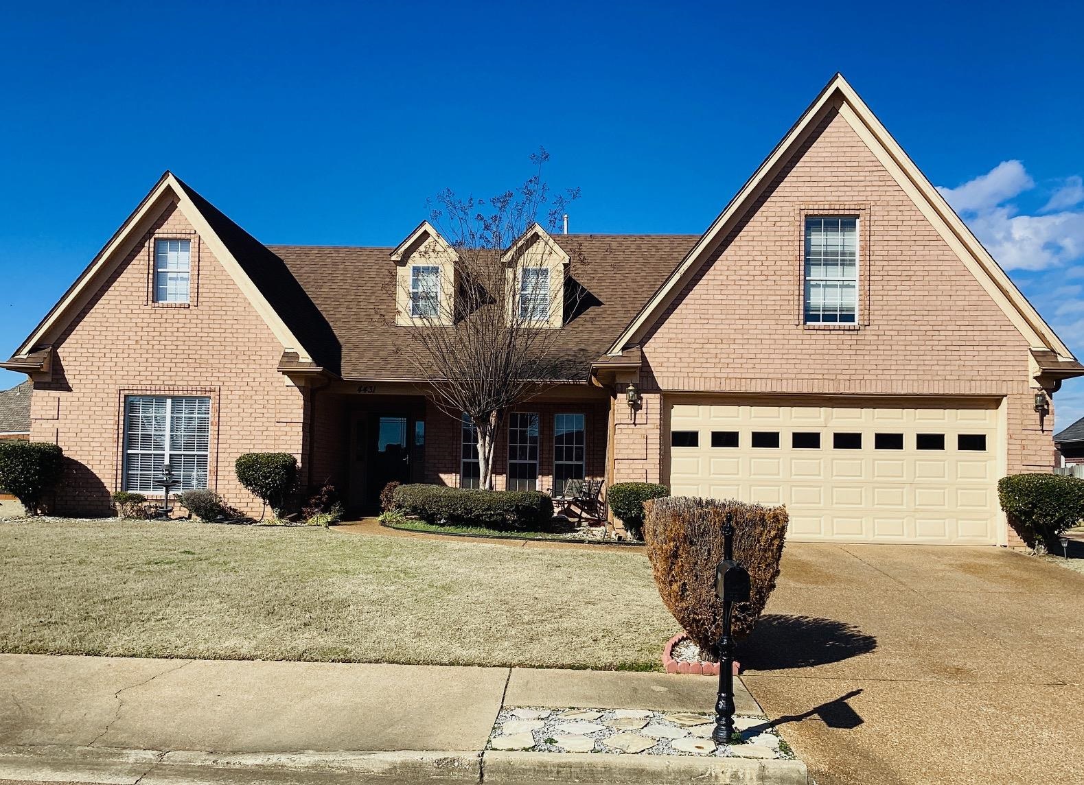 a front view of a house with sitting area