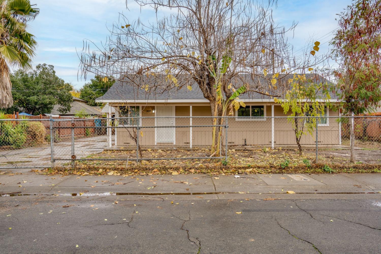 front view of a house with a trees