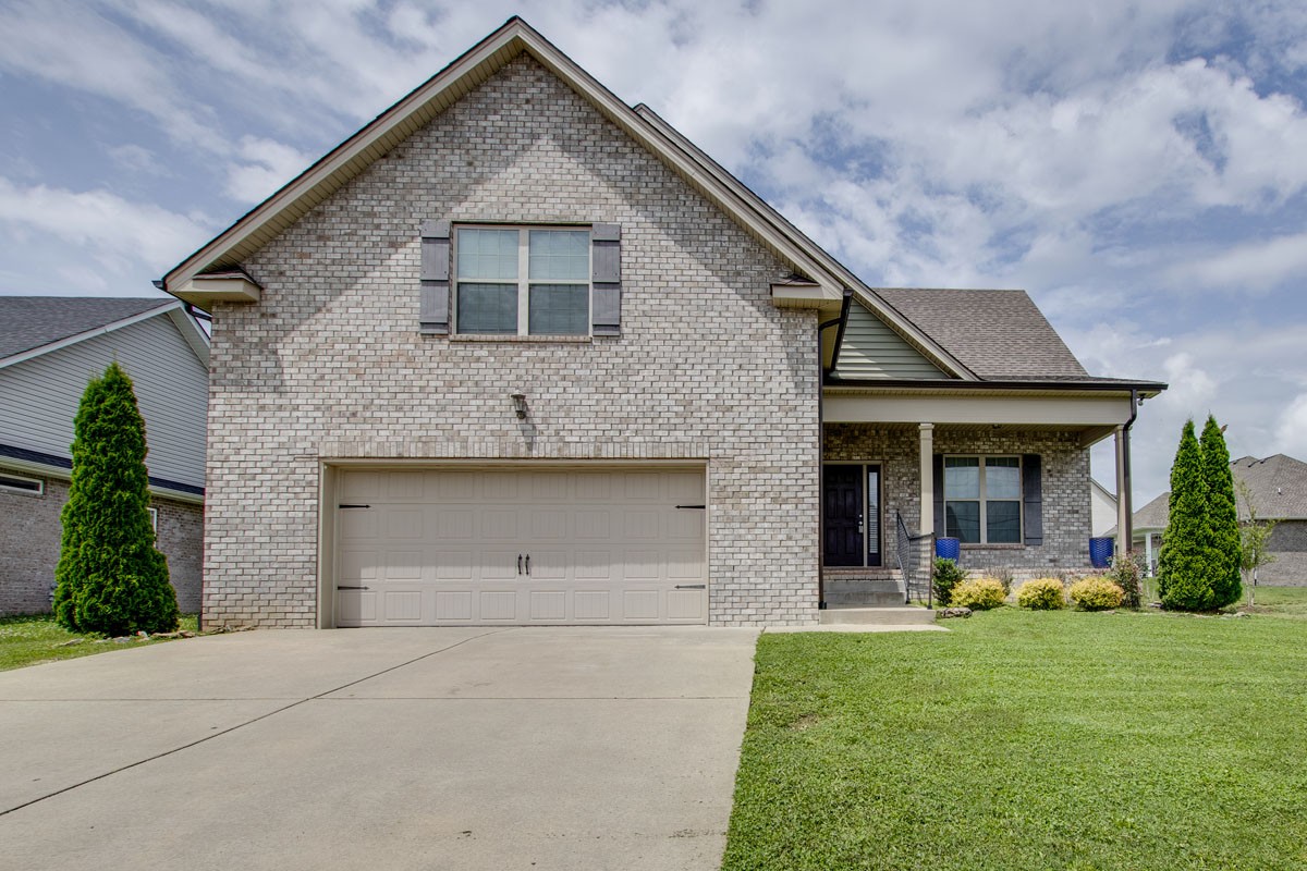 Front of this brick 3 BR, 2 BA home with 2 car attached garage. The home features Den with vaulted ceilings, beautiful soaring stone fireplace, kitchen with granite counter tops, Utility room, huge bonus room and 2 car att. garage.