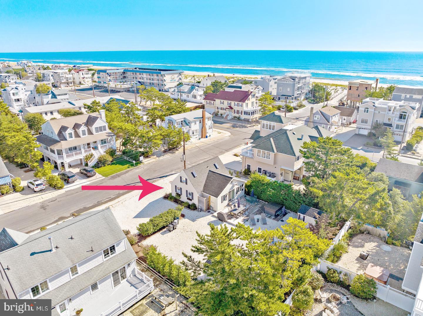 an aerial view of residential building and ocean