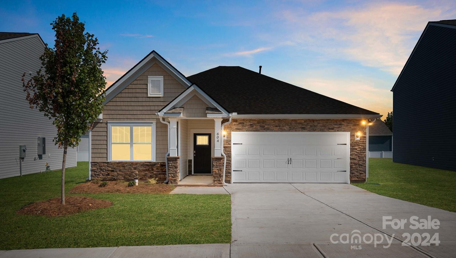 a front view of a house with a yard