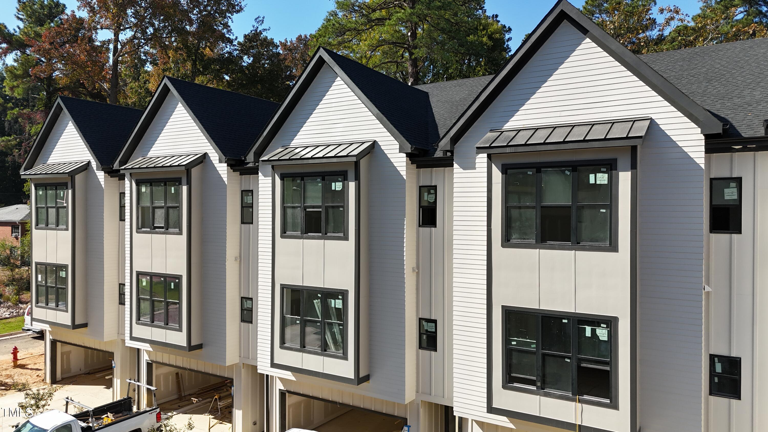 a view of residential houses with glass windows