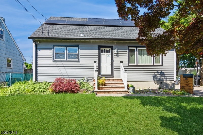 a view of a house with garden and plants