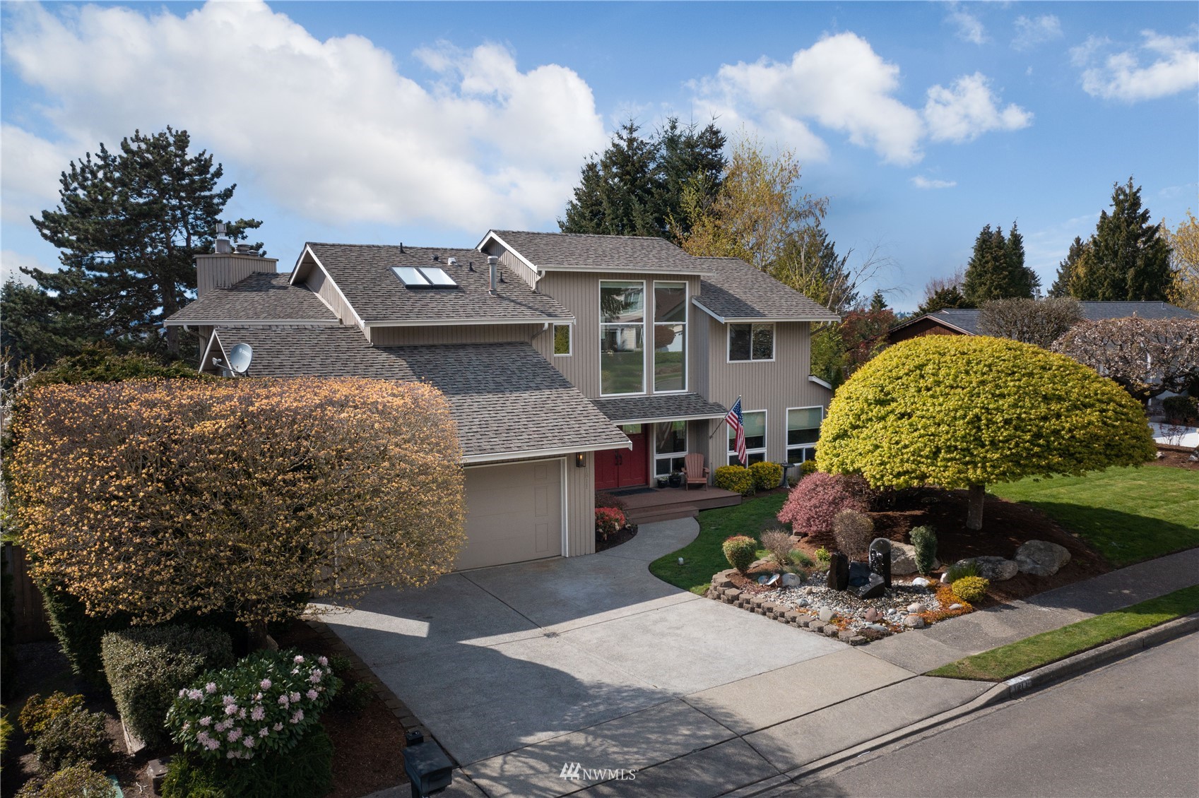 a front view of a house with garden