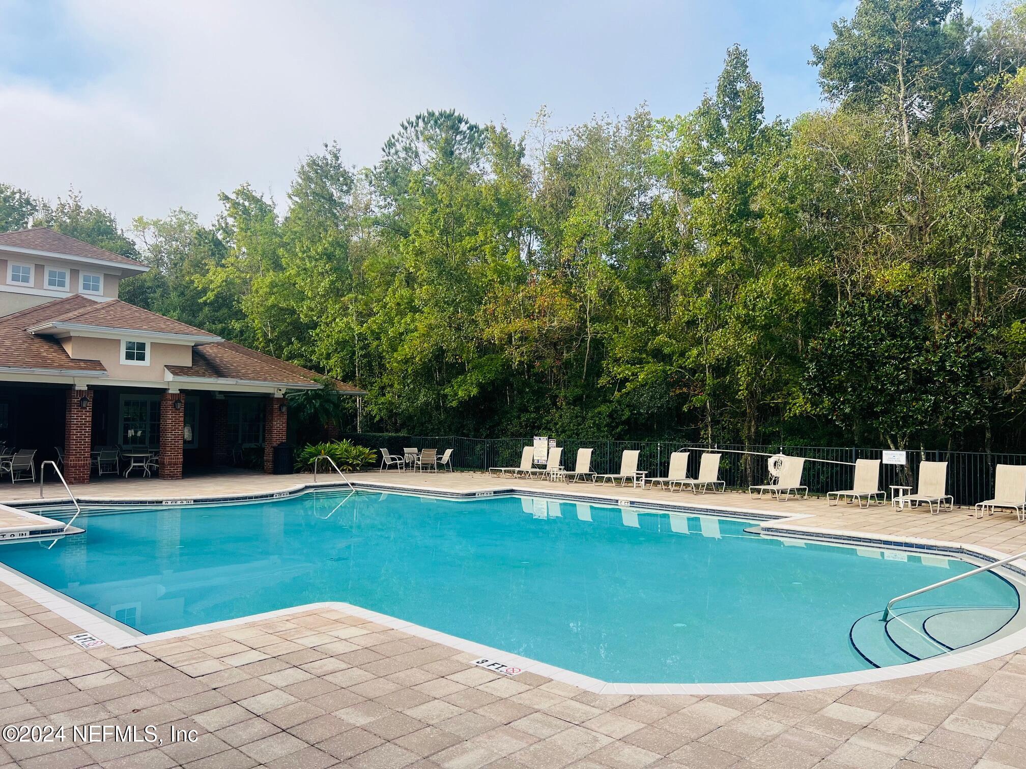 a view of a house with swimming pool