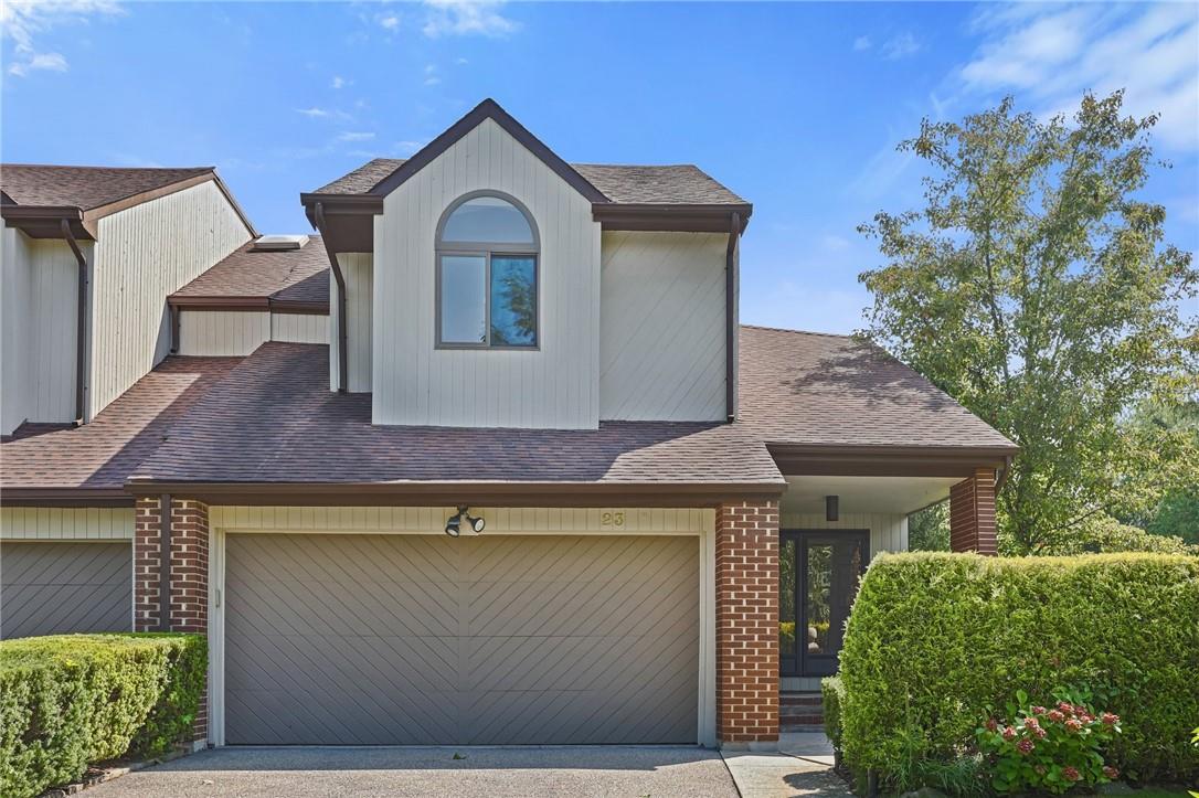 a front view of a house with garage