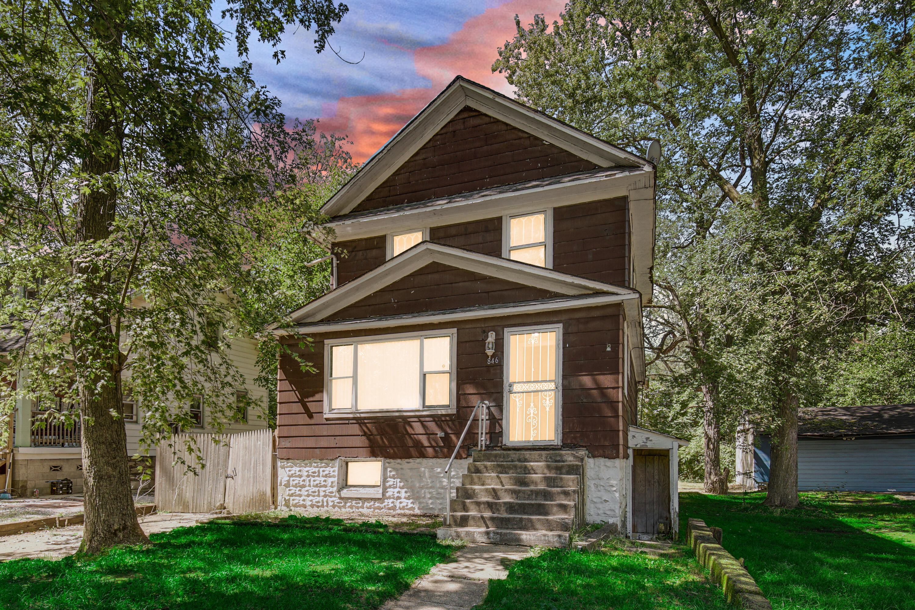 a front view of a house with a yard