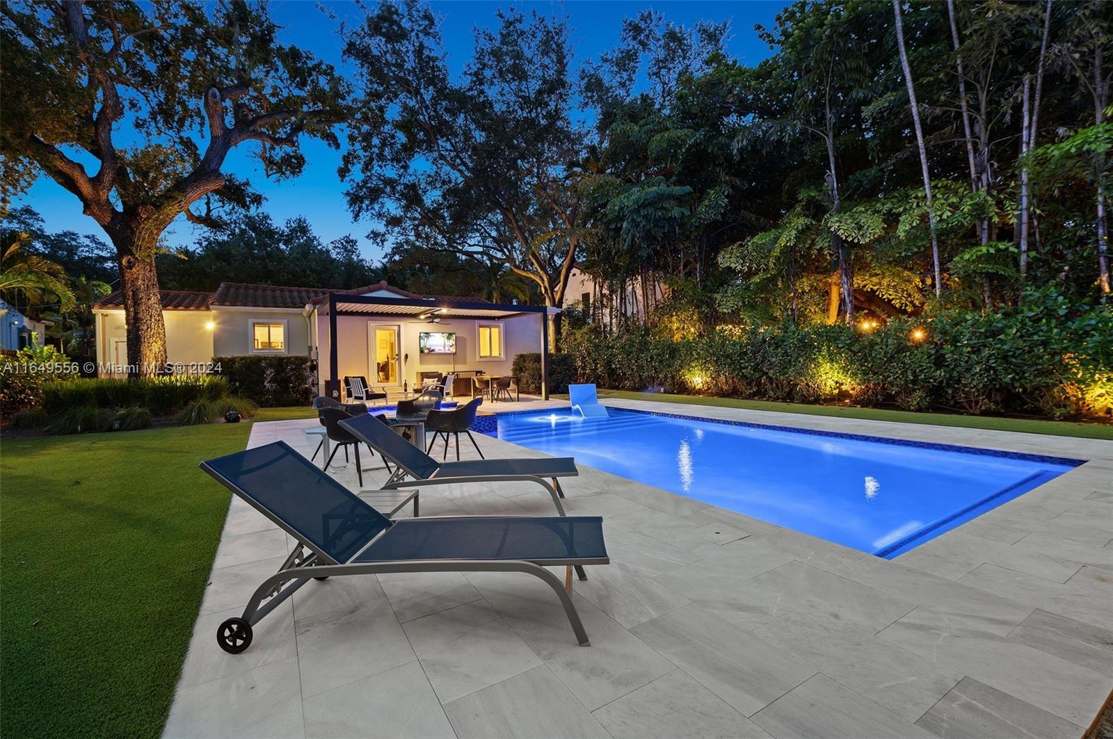 a view of swimming pool with outdoor seating and yard