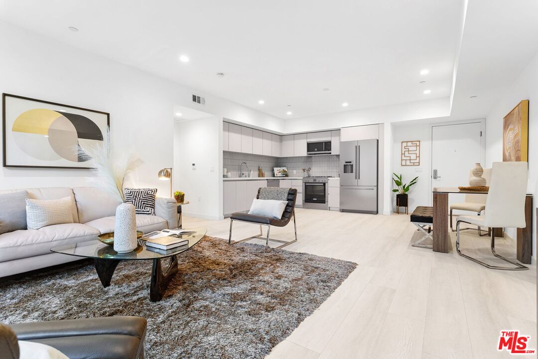 a living room with furniture and a table