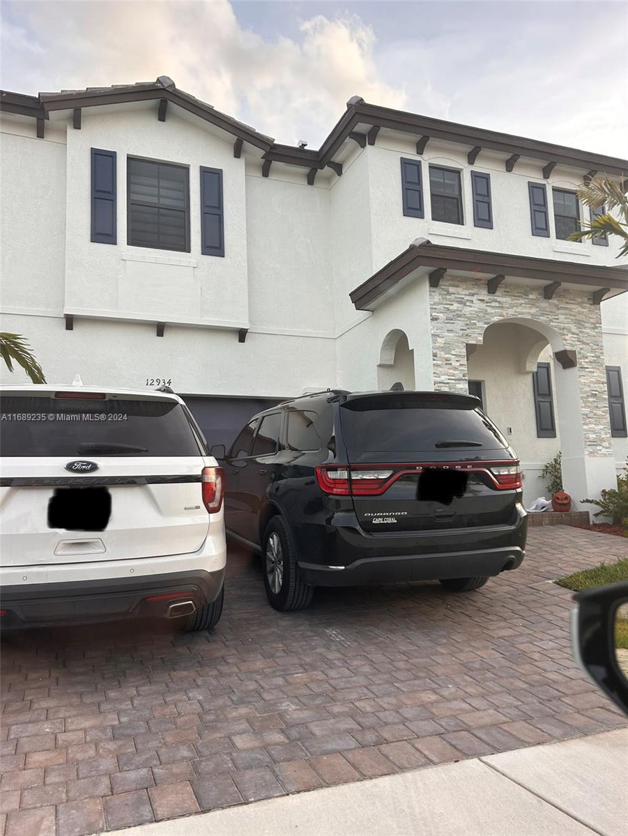 a car parked in front of a house