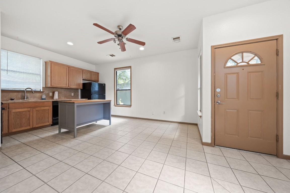 a view of a kitchen with microwave and cabinets