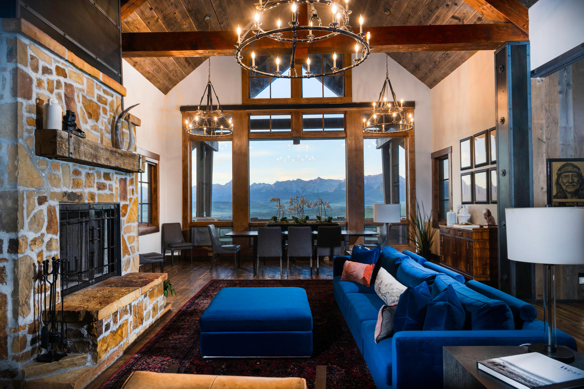 a living room with fireplace furniture and a floor to ceiling window