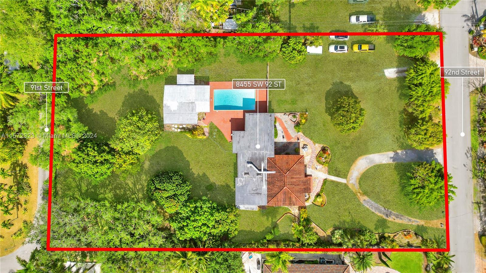 an aerial view of house with swimming pool outdoor seating and yard