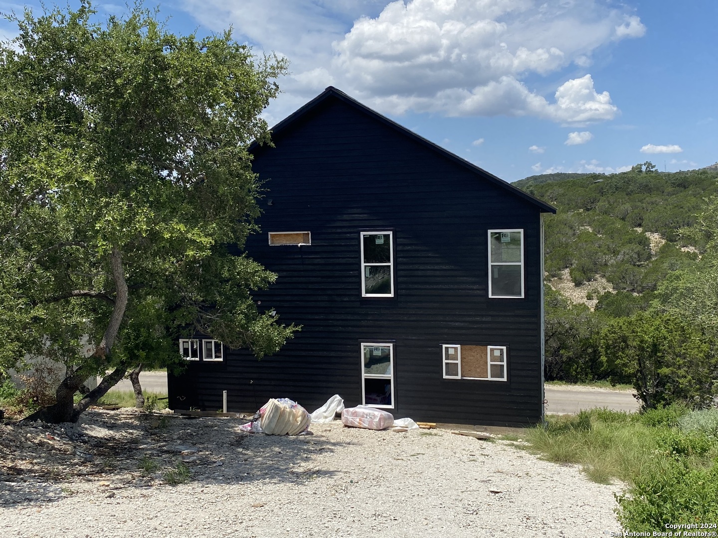 a front view of a house with a yard