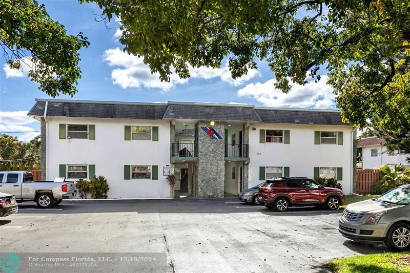 a view of a car park in front of house