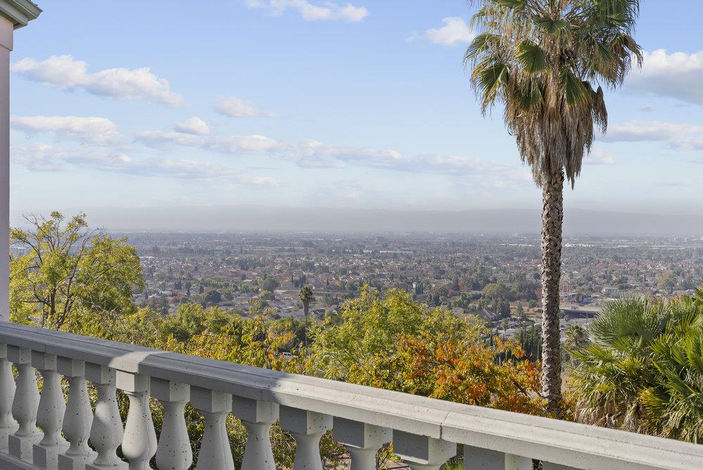 a view of a balcony with an ocean view