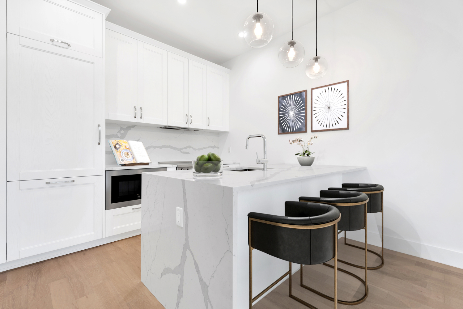 a kitchen with stainless steel appliances kitchen island a white counter top space cabinets and a wooden floor