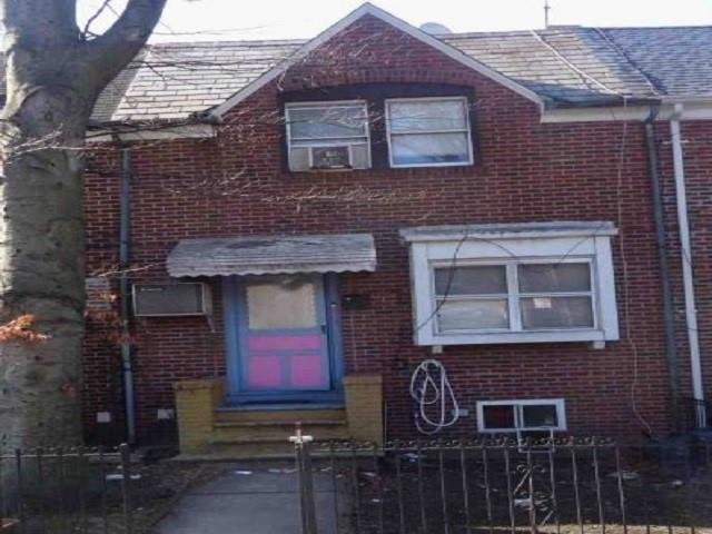 a front view of a house with glass windows