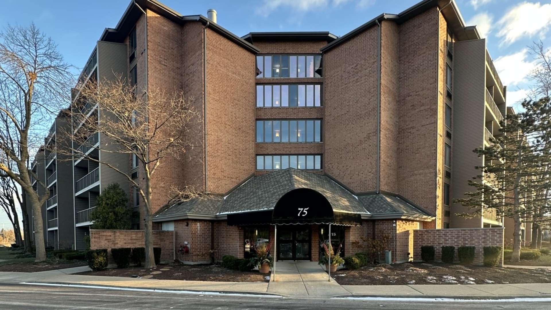 a front view of a building and a street