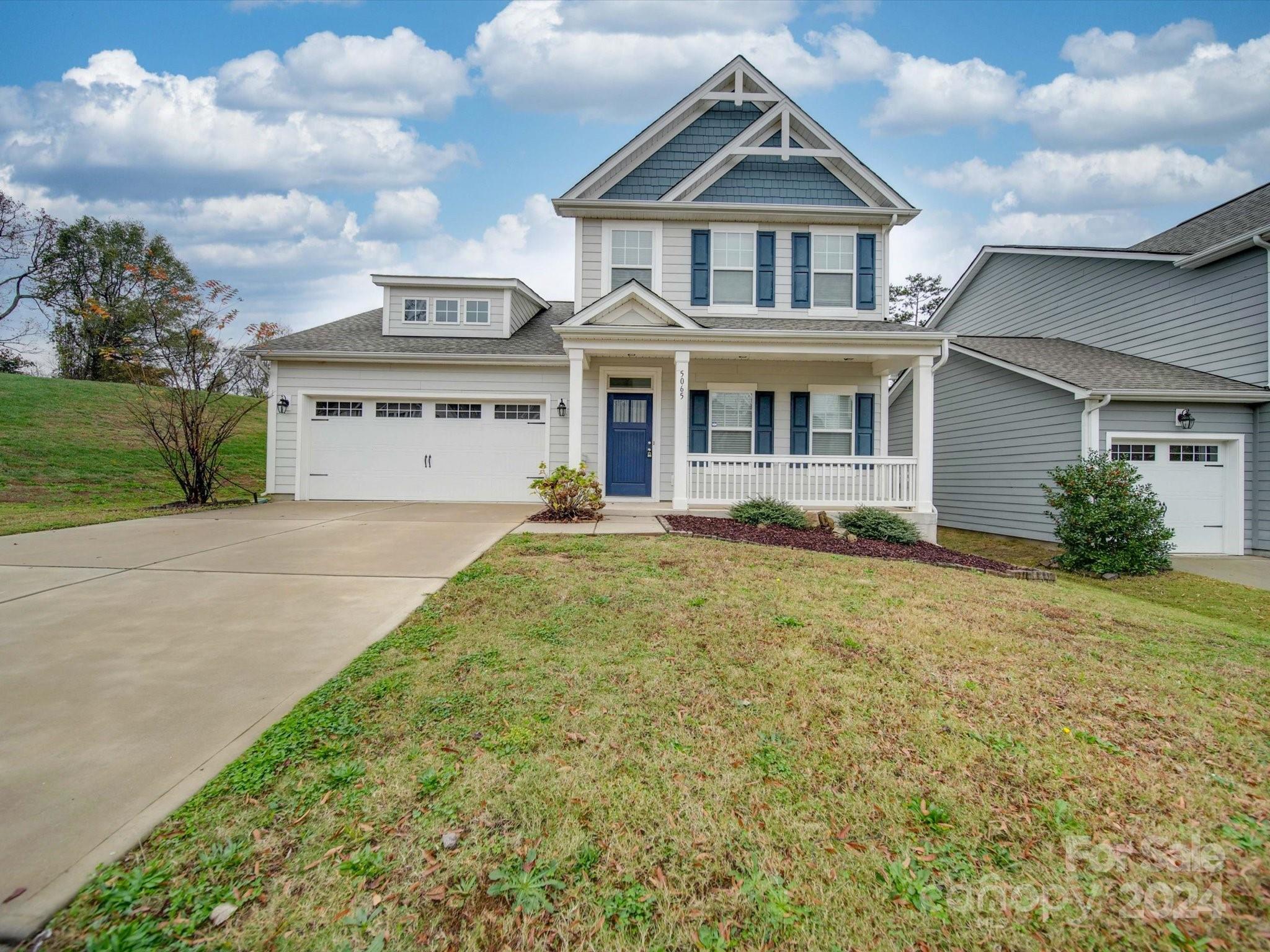 a front view of a house with yard