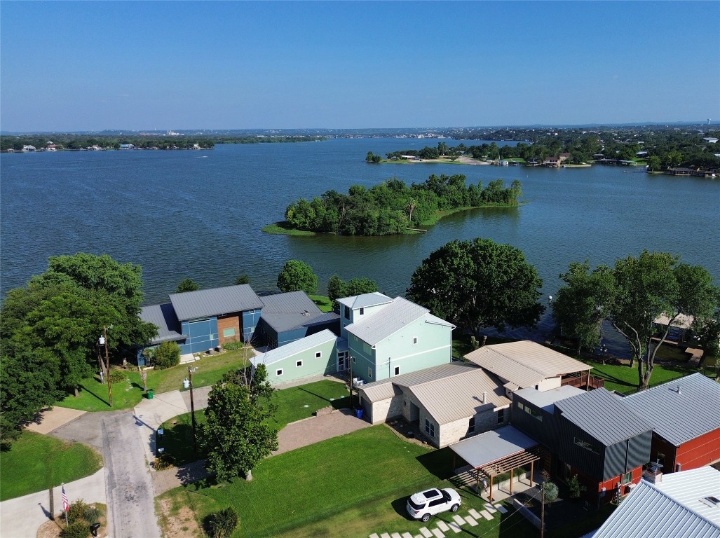 an aerial view of a house with a lake view