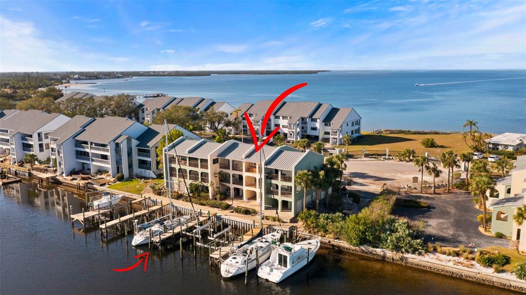 an aerial view of a house with a ocean view