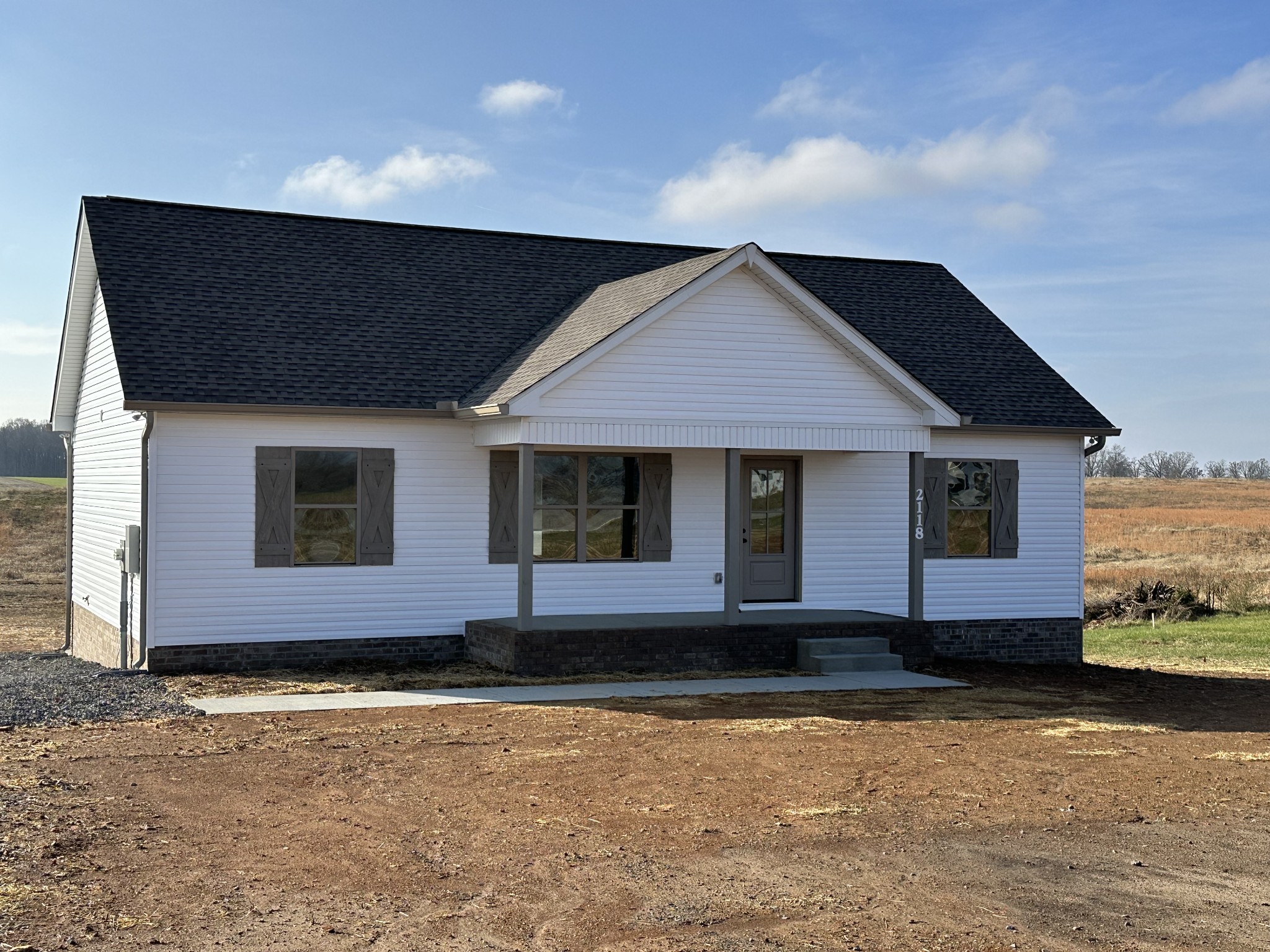 a front view of a house with yard