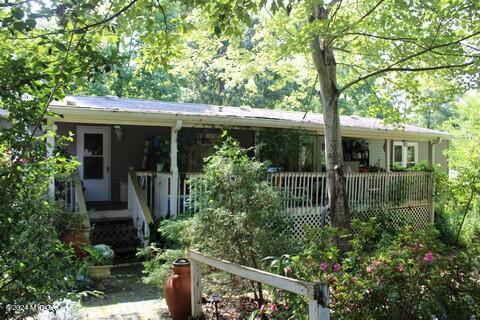 front view of a house with a small yard