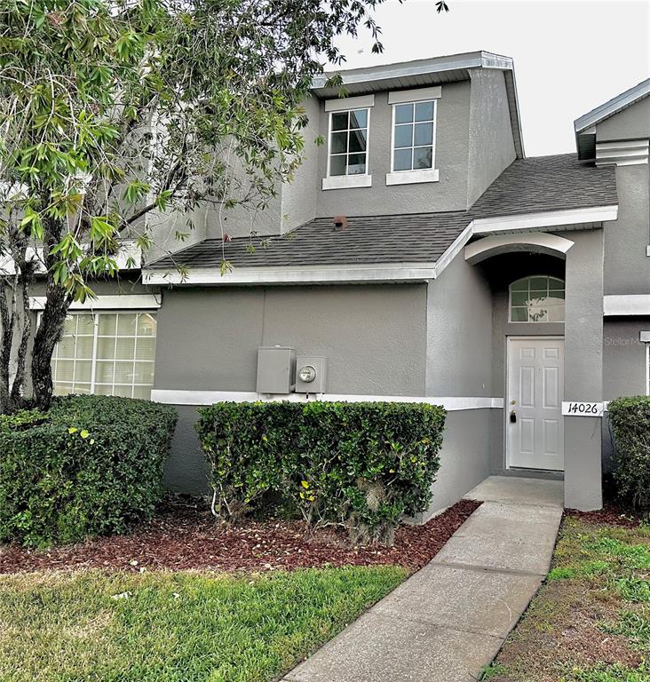 a front view of a house with garage